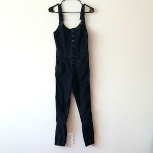 Black formfitting overalls